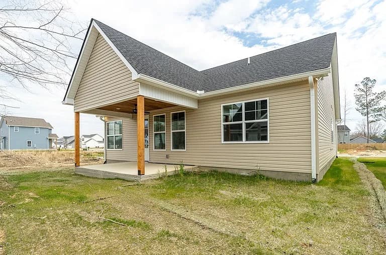Rear exterior with covered back patio — The Daly by S&T Construction