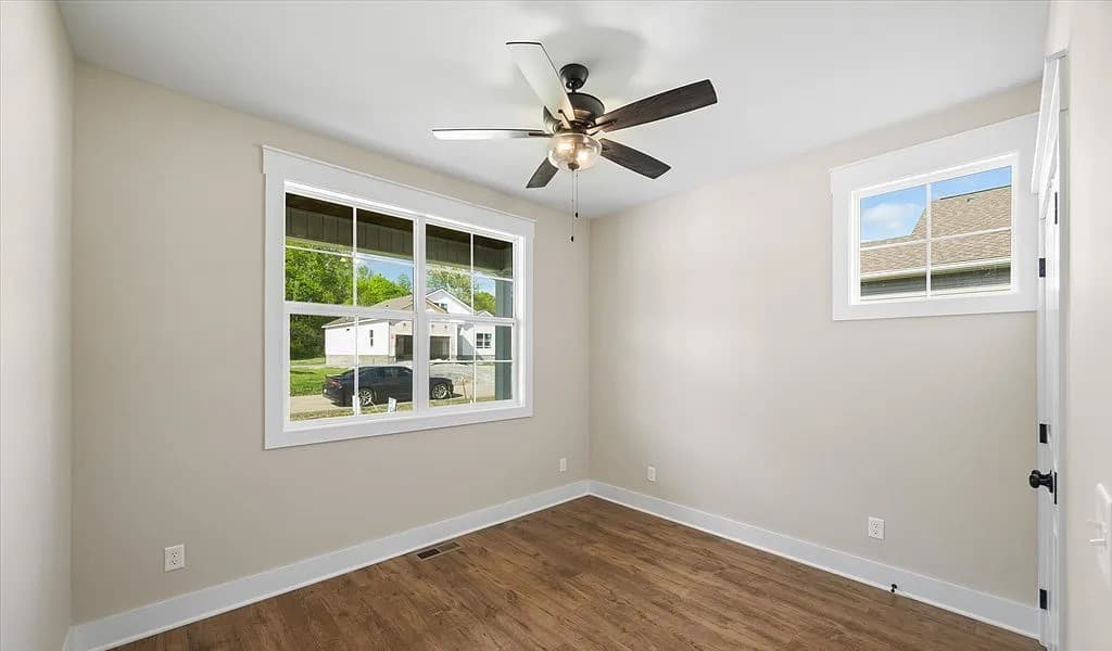Bedroom interior with hardwood floors — The Daly by S&T Construction