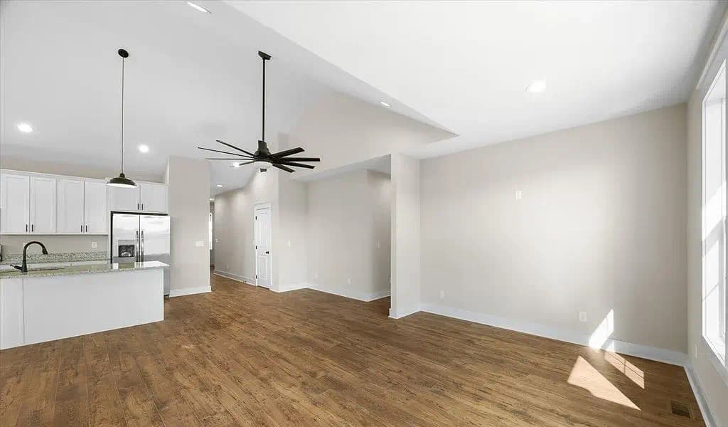 Open living area with natural light — The Kaley by S&T Construction