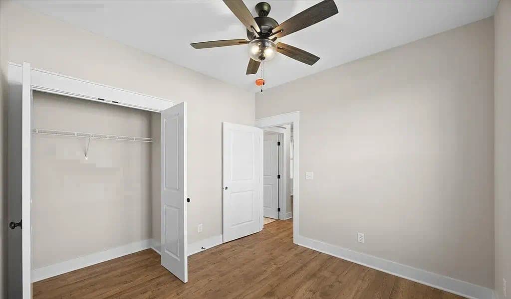 Bedroom with walk-in closet — The Kaley by S&T Construction
